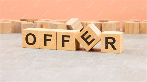 Premium Photo | Word offer on wooden cubes and wooden background