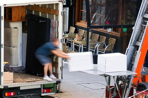 Premium Photo Moving Company Working With Elevator In Building