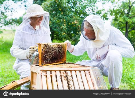 Beekeeper with smoker controlling b Stock Photo by ©Kzenon 139248870