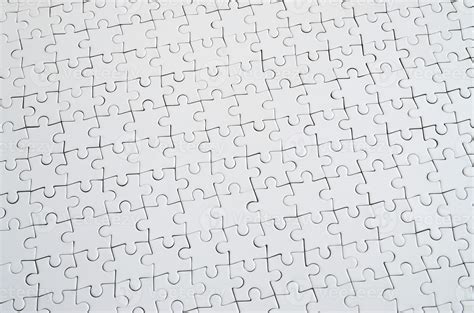 Close Up Texture Of A White Jigsaw Puzzle In Assembled Condition Top