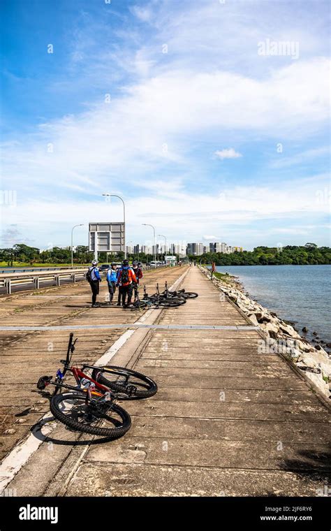 Cyclists spotted along Yishun Dam, Singapore Stock Photo - Alamy