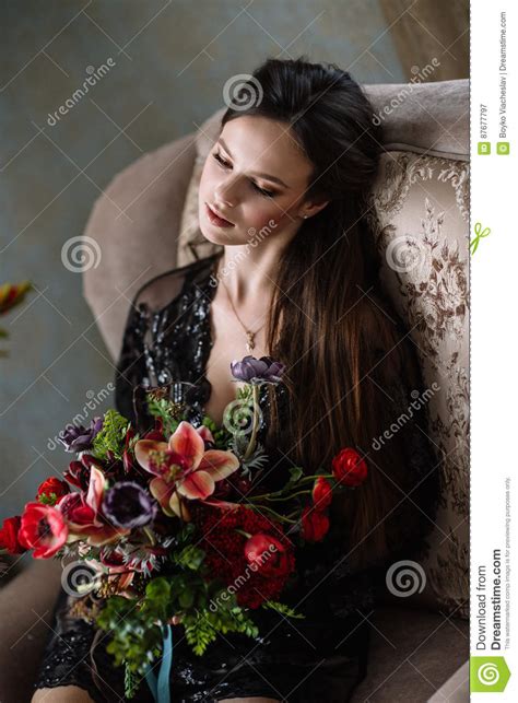 Beautiful Young Sweet Blonde Girl With A Wedding Bouquet In The Hands