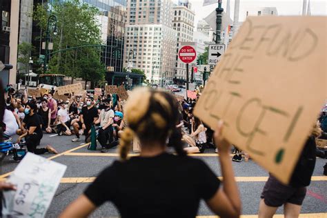 Crowd of Protesters Holding Signs and Kneeling · Free Stock Photo