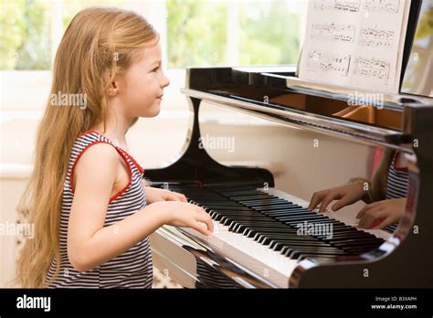 Young Girl Playing Piano Stock Photo Alamy