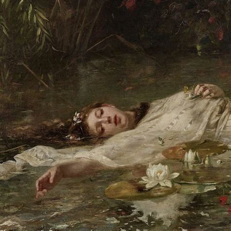 a woman laying on the ground in water