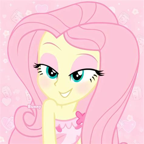 A Pink Pony With Long Hair And Blue Eyes Is Looking At The Camera While