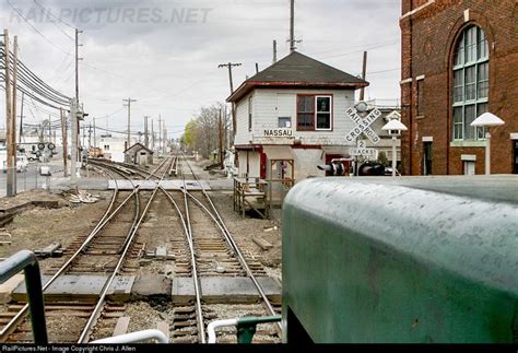 An Old Train Station With Tracks Running Parallel To Each Other And