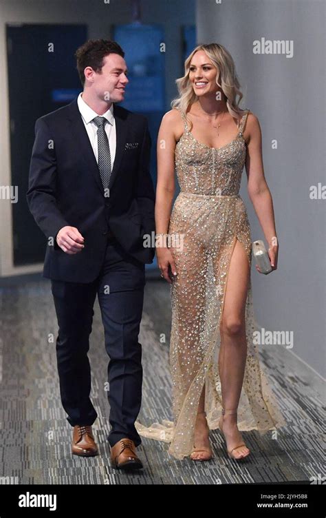 Lachie Neale Of The Lions And His Wife Julie Neale Are Seen Arriving