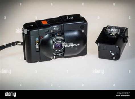 An Olympus XA 35mm Film Rangefinder Camera With A11 Detachable Flash