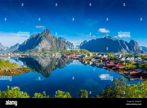 Perfect Reflection Of The Reine Village On The Water Of The Fjord In