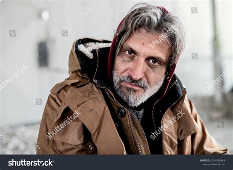 Portrait Homeless Beggar Man Sitting Outdoors Stock Photo