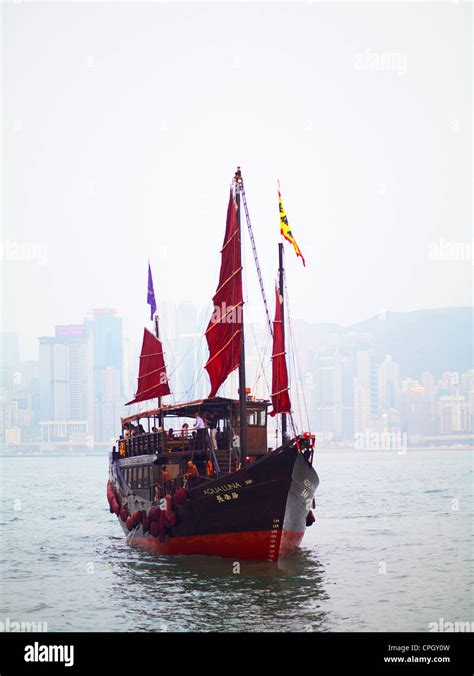 An Old Style Hong Kong Junk Boat Sails In Victoria Harbour In Hong Kong