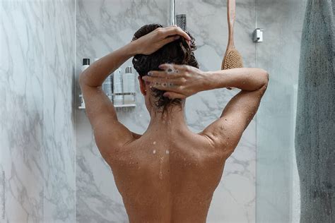 Naked Woman Taking Shower At Home By Stocksy Contributor Milles