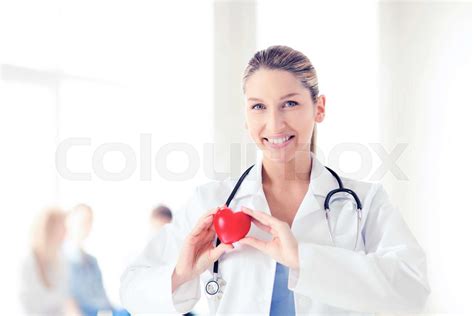 female doctor with heart | Stock image | Colourbox