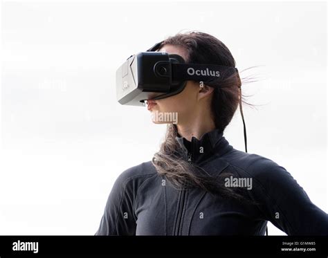 Young Woman Wearing Augmented Reality Oculus Rift Virtual Reality