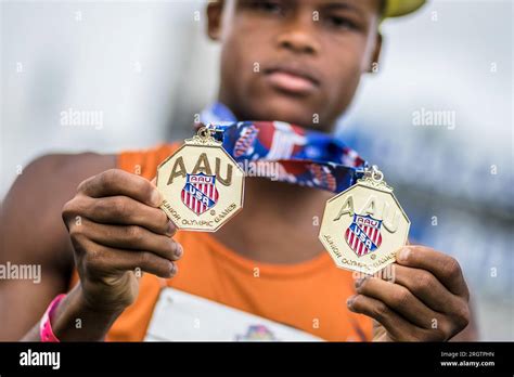 August Ian Hill Of Pearland Track Xpress Holds His Gold Medals