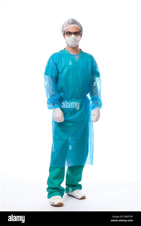 Male Surgeon Holding Scalpel In Theater Scrubs Stock Photo Alamy