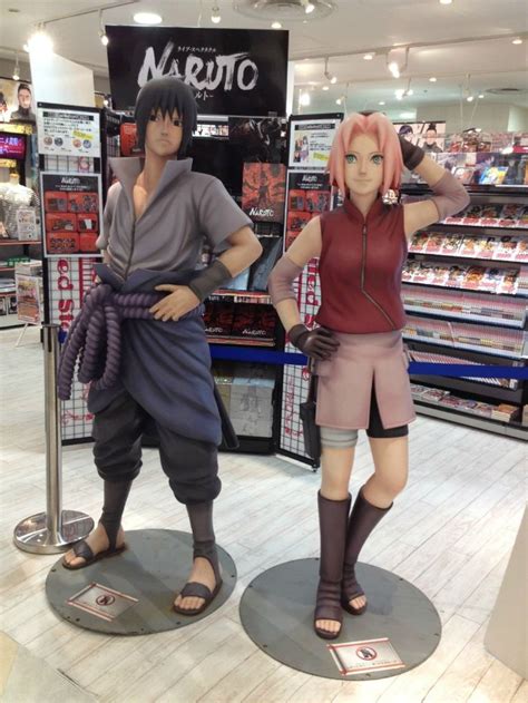 Two Figurines Are Displayed In A Store