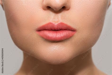 Female Lips After Permanent Makeup Lip Blushing Procedure Stock Photo