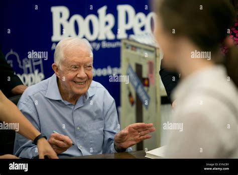 Former President and Nobel Peace Prize winner, Jimmy Carter, signs ...