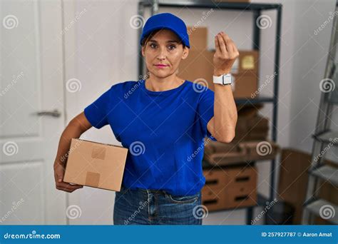 Middle Age Brunette Woman Working Wearing Delivery Uniform And Cap Doing Italian Gesture With