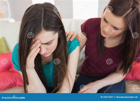 Girl Comforting Her Crying Friend On The Couch Stock Image Image Of Communication Homey 33573421