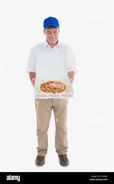 Mature Delivery Man Looking At Fresh Pizza Stock Photo Alamy