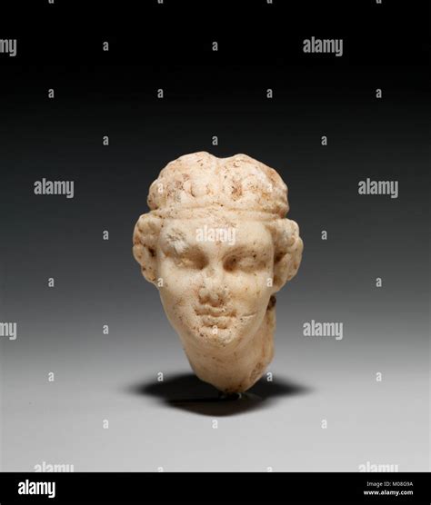 This Marble Sculpture Features The Head Of A Female Satyr A Figure