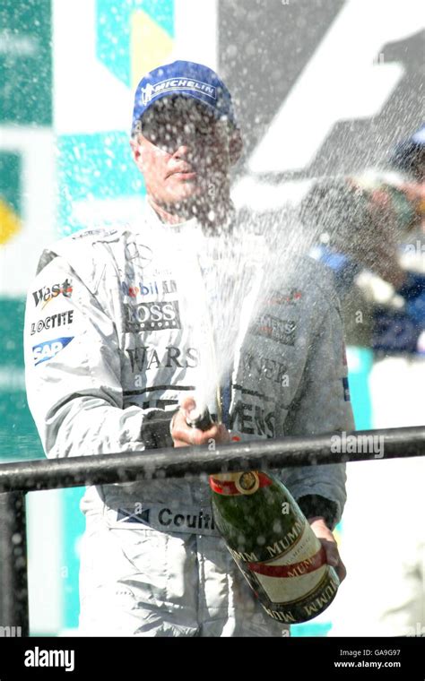 Mclarens David Coulthard Sprays Champagne Following His Third Place