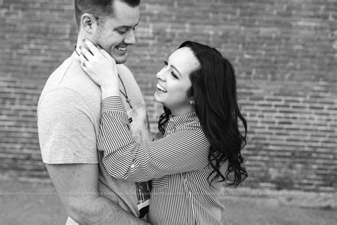 Urban Downtown Akron Ohio Engagement Engaged Couple Posing Street