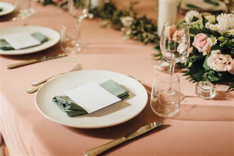 a dining table set up for two with place settings and cutlers Stock ...