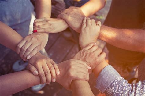 Premium Photo Cropped Image Of People Holding Hands