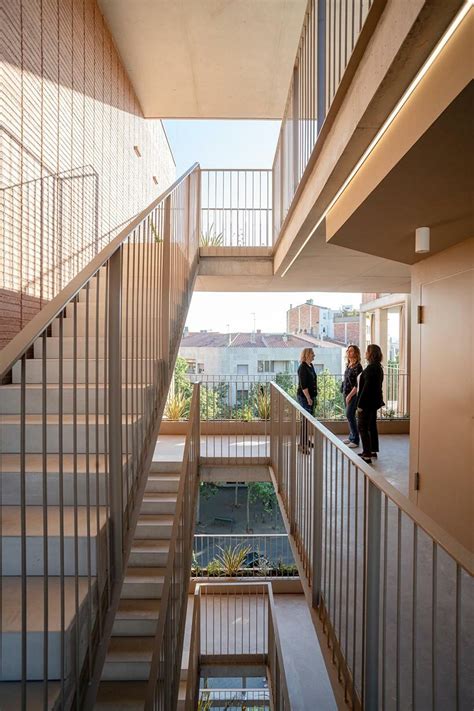 corner building in barcelona boasts open green courtyard