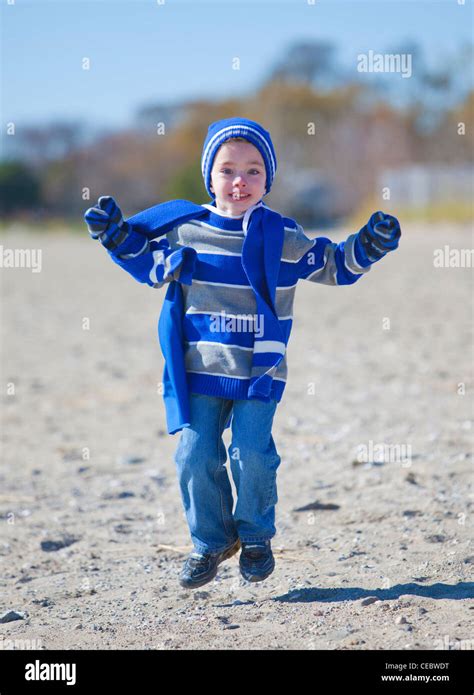 Young Boy At The Beach Wearing Winter Clothing Stock Photo Alamy