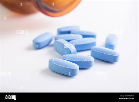 Blue Pills And Brown Medical Bottle On White Background Stock Photo Alamy