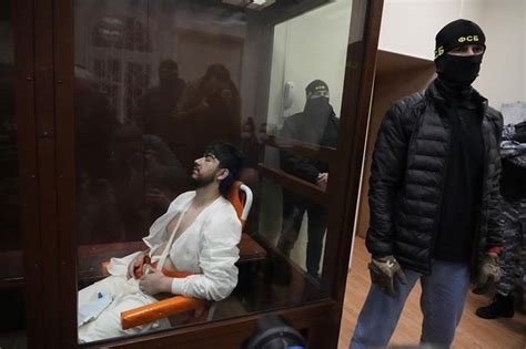 4 Men Charged In Moscow Attack Showing Signs Of Beatings At Hearing As