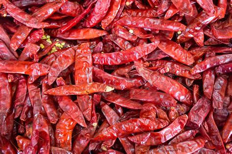 Lot of dried hot red chili pepper at vegetable stall | High-Quality Food Images ~ Creative Market