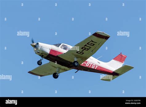 Piper Pa 28 Cherokee Warrior Ii Light Aircraft Plane Flying In Blue Sky