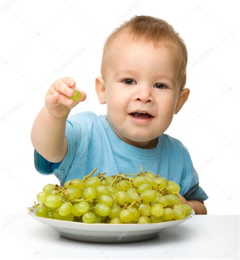 Little Boy Is Eating Grapes Stock Photo By ©kobyakov 7547118