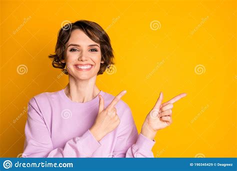 Portrait Of Positive Cheerful Girl Promoter Point Index Finger