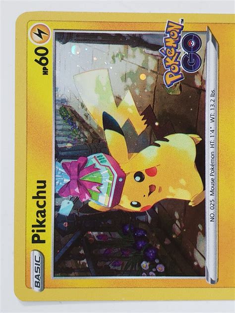 HOLO Present Pikachu SWSH234 NM M COSMOS HOLO Pokemon Go PROMO TCG