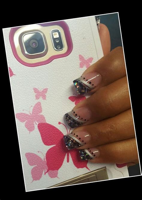 A Woman S Hand With Pink And Black Butterflies On Her Phone Case Which