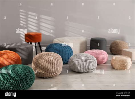 Many Stylish Different Poufs Indoors Home Design Stock Photo Alamy