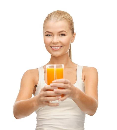 Premium Photo Young Woman Holding Glass Of Orange Juice