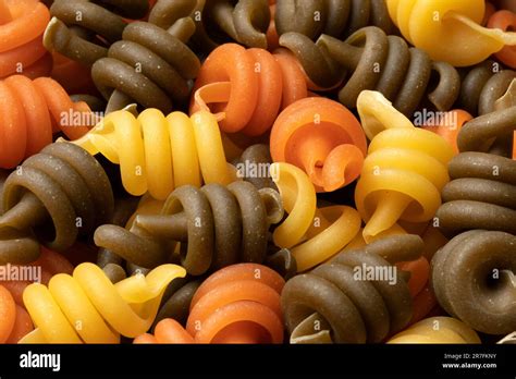 Uncooked Trottole Tricolore Pasta Close Up Full Frame As Background