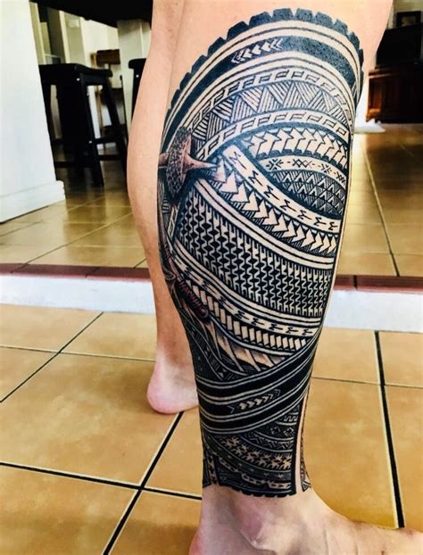 A Man S Leg With An Intricate Tattoo On It