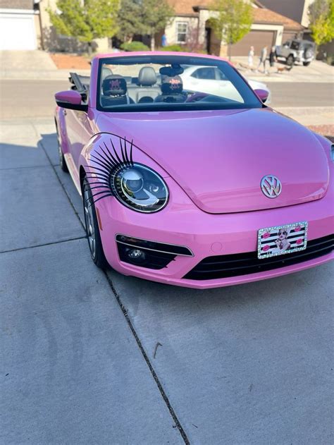 Pink Volkswagen Beetle With Car Lashes