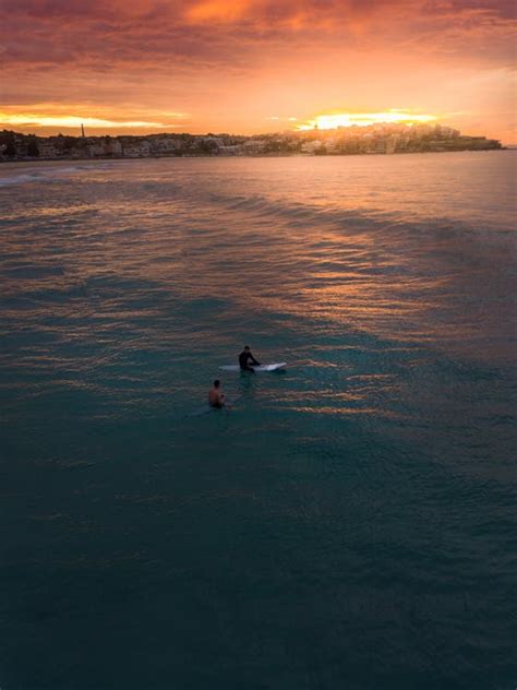 Photo of Two People Surfing in Bondi Beach · Free Stock Photo