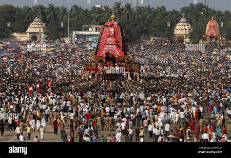 Devotees Throng Around A Chariot As They Pull It During The ‘return Of