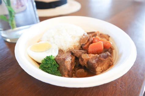 Cerdo Guisado Con Arroz Y Salsa O Arroz Con Cerdo Guisado Imagen De